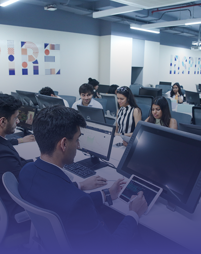 students working on computers in modern classroom learning environment
