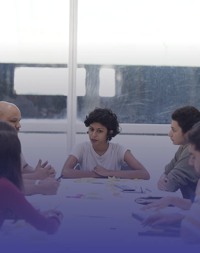 students engaged in group discussion and teamwork in classroom setting
