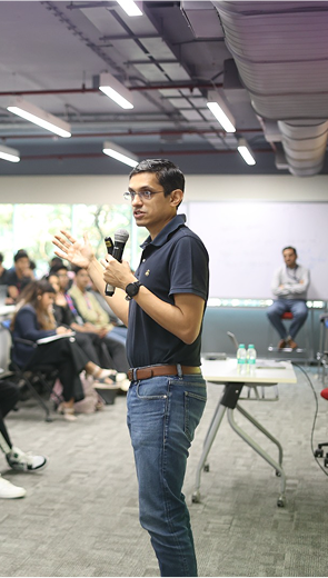 Mayank Kumar co founder upGrad speaking at student event