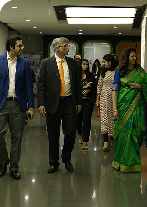 Niranjan Hiranandani founder Hiranandani Group walking at corporate campus event
