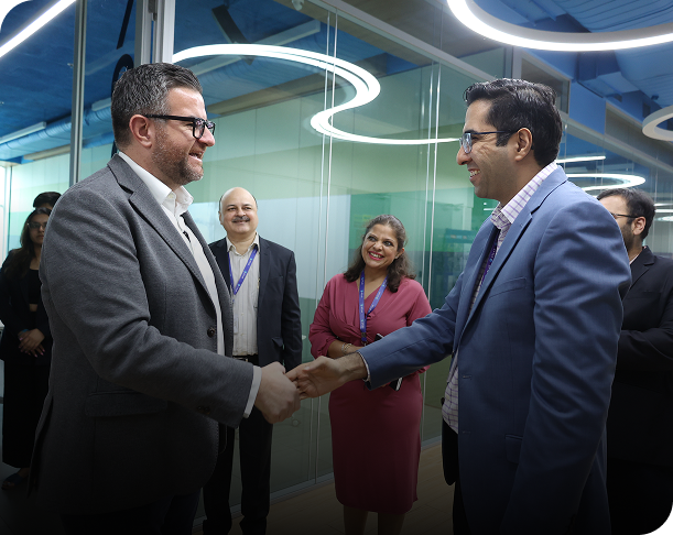 business professionals handshake during corporate meeting in office environment