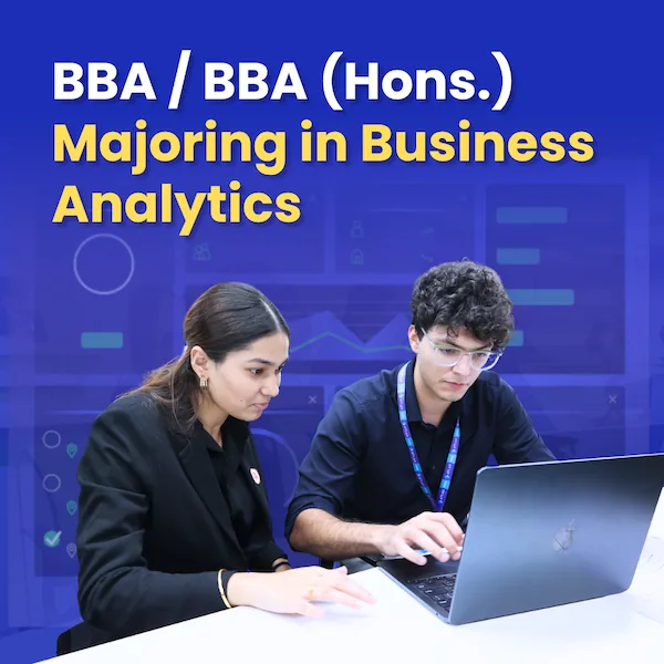BBA and BBA Hons Business Analytics students working on laptop learning data analysis skills