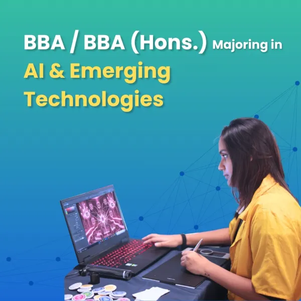 Student working on a laptop for BBA (Hons.) in AI and Emerging Technologies program at ATLAS University