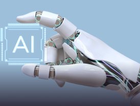 Robotic hand reaching toward a glowing AI chip, representing artificial intelligence